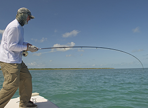 Fly fisherman hooked up on a tarpon in the Florida Keys